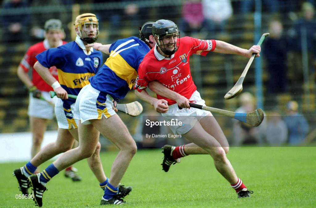 15 April 2001; Pat Mulcahy of Cork in action against Eddie Enright of Tipperary during the Allianz GAA National Hurling League Division 1B Round 5 match between Tipperary and Cork at Semple Stadium in Thurles, Tipperary. Photo by Damien Eagers/Sportsfile
