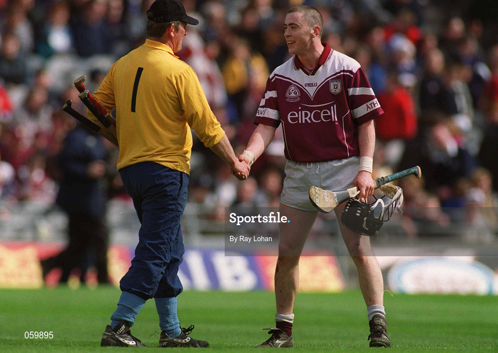 16 April 2001; Eugene Cloonan of Athenry shakes hands with Graigue Ballycallan goalkeeper Johnny Ronan at the end of normal time after scoring a last minute goal which sent the match into extra time during the AIB All-Ireland Senior Club Hurling Championship Final match between Athenry and Graigue Ballycallan at Croke Park in Dublin. Photo by Ray Lohan/Sportsfile