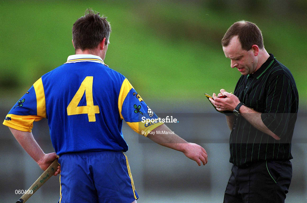 15 April 2001; Referee Michael Carroll takes the name of Gerry Byrne of Wicklow during the Leinster Senior Hurling Championship First Preliminary Round match between Wicklow and Kildare at Pearse Park in Arklow, Wicklow. Photo by Ray McManus/Sportsfile