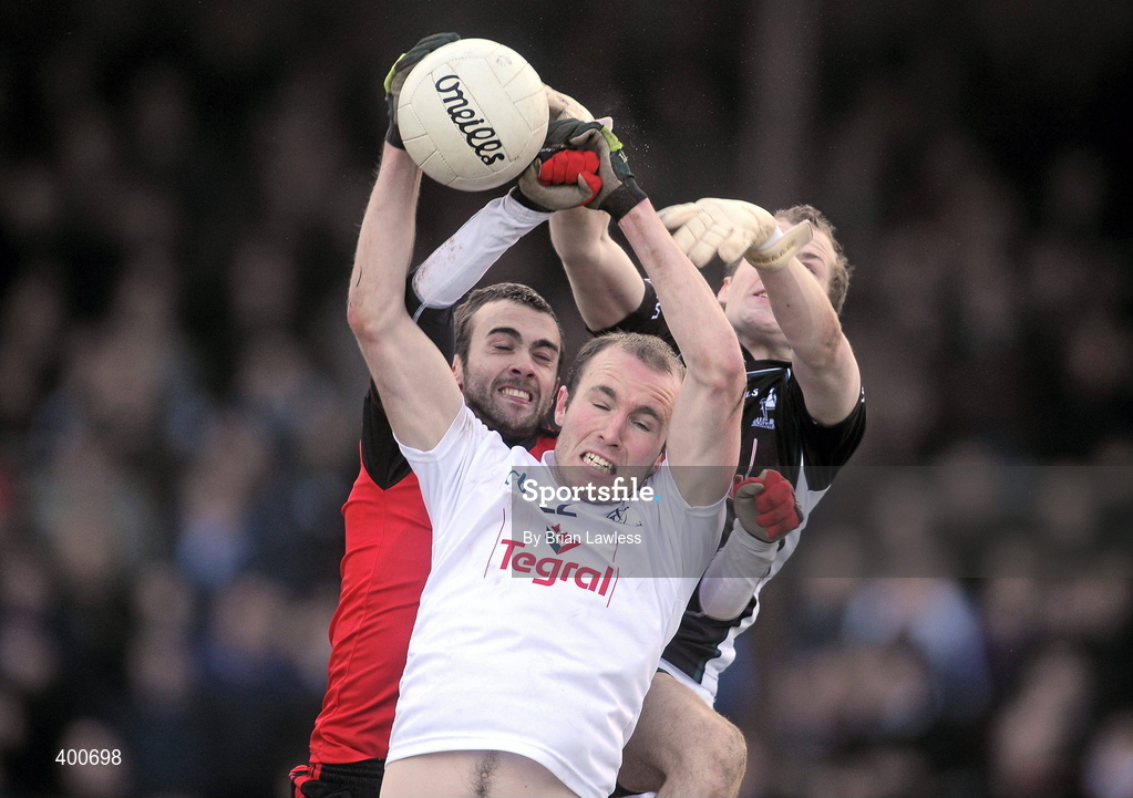 7 February 2010; Hugh McGrillen and Shane McCormack, right, Kildare, in action against Conor Laverty, Down. Allianz GAA Football National League, Division 2, Round 1, Kildare v Down. St Conleth's Park, Newbridge, Co. Kildare. Picture credit: Brian Lawless / SPORTSFILE
