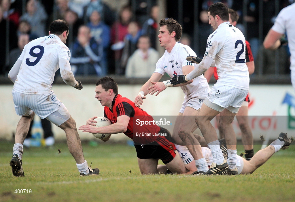 7 February 2010; John Clarke, Down, in action against, from left, Dermot Earley, Daryl Flynn, on the ground, Emmet Bolton, and Andriú McLoughlin, Kildare. Allianz GAA Football National League, Division 2, Round 1, Kildare v Down. St Conleth's Park, Newbridge, Co. Kildare. Picture credit: Brian Lawless / SPORTSFILE
