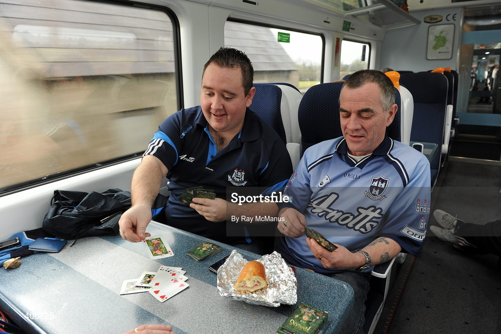 7 February 2010; Dublin supporters Paul Martin, left, and his uncle Kevin Martin, from Finglas, playing cards on train to the game. Allianz GAA Football National League, Division 1, Round 1, Kerry v Dublin. Fitzgerald Stadium, Killarney. Picture credit: Ray McManus / SPORTSFILE