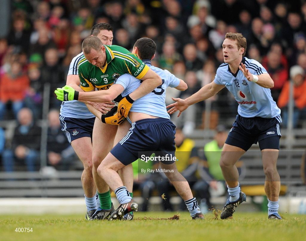7 February 2010; Michael Quirke, Kerry, is tackled by Dublin players Éamon Fennell, left, Blaine Kelly, 23, and Paul Flynn. Allianz GAA Football National League, Division 1, Round 1, Kerry v Dublin. Fitzgerald Stadium, Killarney. Picture credit: Ray McManus / SPORTSFILE