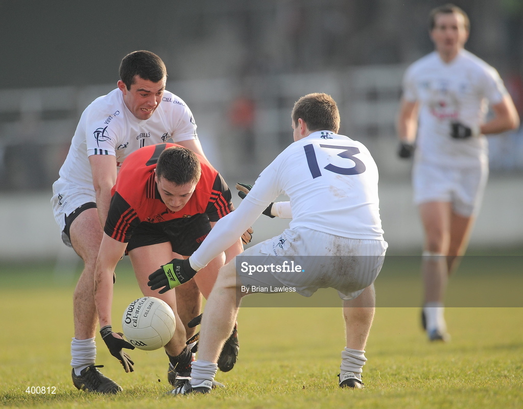 7 February 2010; Conor Garvey, Down, in action against Padraig O'Neill, left, and Karl Ennis, Kildare. Allianz GAA Football National League, Division 2, Round 1, Kildare v Down. St Conleth's Park, Newbridge, Co. Kildare. Picture credit: Brian Lawless / SPORTSFILE
