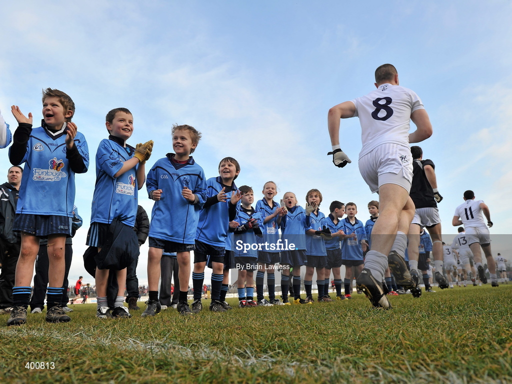 7 February 2010; Young members of Eadestown GFC, Kildare, cheer on the Kildare players as they make their way out for the start of the match. St Conleth's Park, Newbridge, Co. Kildare. Picture credit: Brian Lawless / SPORTSFILE
