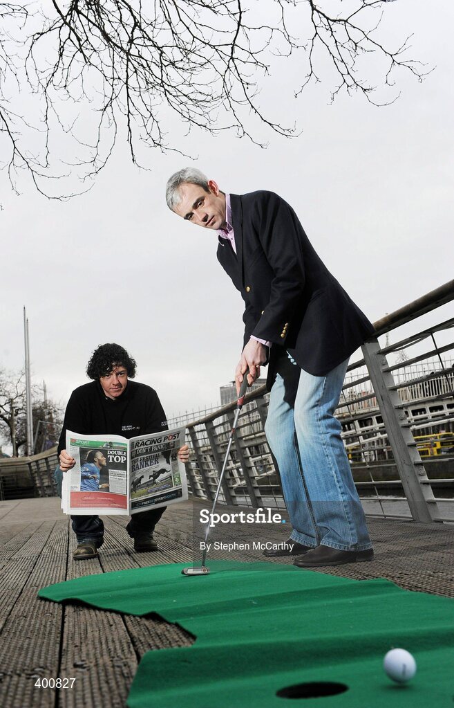 8 February 2010; Ireland has a new national daily newspaper with the launch of the The Irish Racing Post. It will combine the best of the UK edition of the Racing Post, long considered 'the bible' by racing and sports betting enthusiasts, with extensive additional content for Irish readers only. As well as unrivalled day-to-day coverage of horseracing, The Irish Racing Post will carry separate weekly supplements covering bloodstock, point-to-pointing and GAA. At the launch of the Irish Racing Post is golf's world number seven Rory McIlroy lining up seven time Irish Champion Jump Jockey Ruby Walsh's putt. The Irish Racing Post Launch, The Liffey Boardwalk, Dublin. Picture credit: Stephen McCarthy / SPORTSFILE