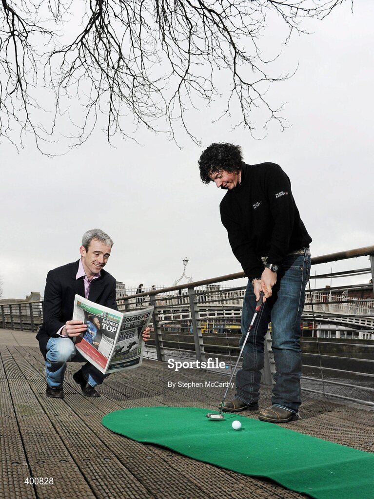 8 February 2010; Ireland has a new national daily newspaper with the launch of the The Irish Racing Post. It will combine the best of the UK edition of the Racing Post, long considered 'the bible' by racing and sports betting enthusiasts, with extensive additional content for Irish readers only. As well as unrivalled day-to-day coverage of horseracing, The Irish Racing Post will carry separate weekly supplements covering bloodstock, point-to-pointing and GAA. At the launch of the Irish Racing Post is seven time Irish Champion Jump Jockey Ruby Walsh keeping a close eye on the putt of golf's world number seven Rory McIlroy. The Irish Racing Post Launch, The Liffey Boardwalk, Dublin. Picture credit: Stephen McCarthy / SPORTSFILE