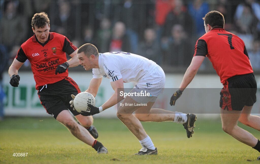 7 February 2010; Daryl Flynn, Kildare, in action against Daniel McCartan, left, and Conor Garvey, Down. Allianz GAA Football National League, Division 2, Round 1, Kildare v Down. St Conleth's Park, Newbridge, Co. Kildare. Picture credit: Brian Lawless / SPORTSFILE