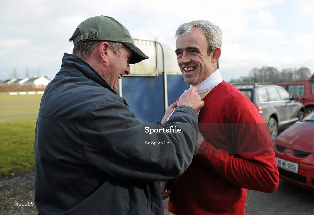 8 February 2010; Declan Brooks ties Ruby Walsh's hunt stock at the Hunt Meeting in Dunsany, Co. Meath. Photo by Sportsfile