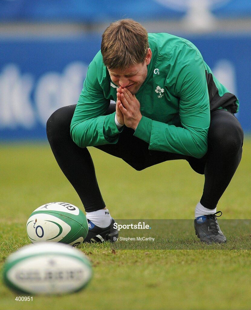 8 February 2010; Ireland's Ronan O'Gara feels a strain as he stretches during squad training ahead of their RBS Six Nations Rugby Championship match against France on Saturday. Ireland rugby squad training, RDS, Ballsbridge, Dublin. Picture credit: Stephen McCarthy / SPORTSFILE