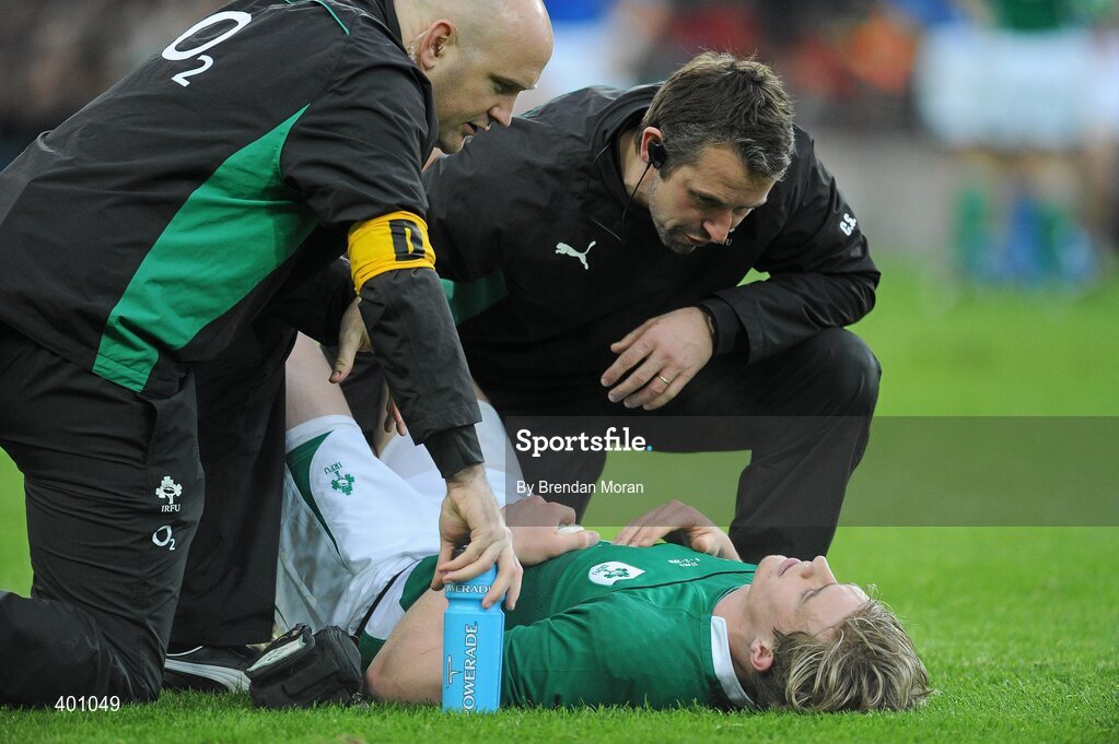 6 February 2010; Andrew Trimble, Ireland, is attended to by team doctor Dr. Eanna Falvey, left, and physio Cameron Steele. RBS Six Nations Rugby Championship, Ireland v Italy, Croke Park, Dublin. Picture credit: Brendan Moran / SPORTSFILE