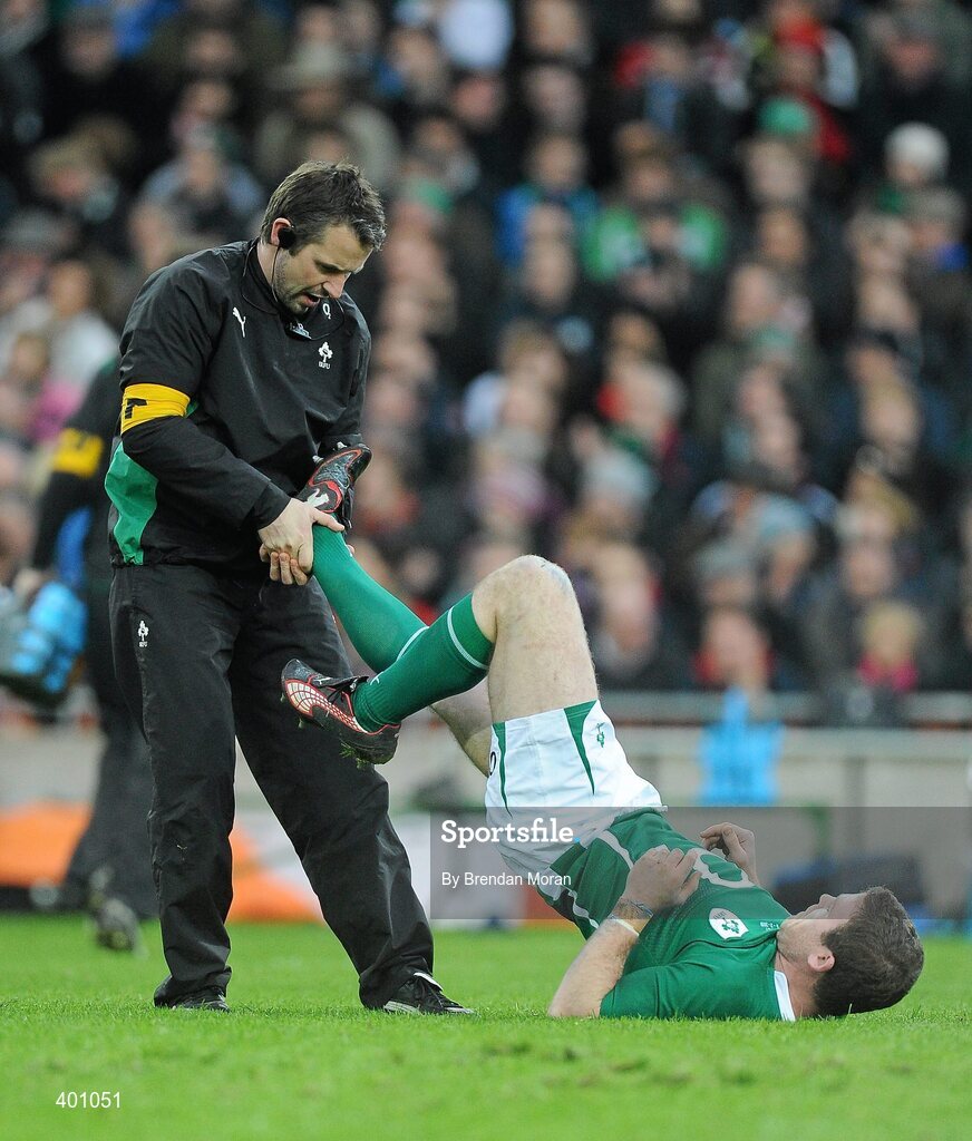 6 February 2010; Ireland's Gordon D'Arcy gets some running repairs from physio Cameron Steele. RBS Six Nations Rugby Championship, Ireland v Italy, Croke Park, Dublin. Picture credit: Brendan Moran / SPORTSFILE