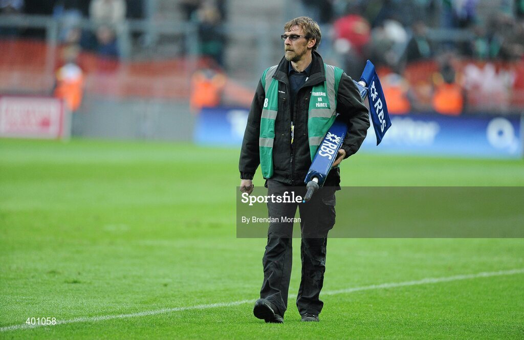 6 February 2010; Chief Groundsman at Croke Park Robert Ellis collects the sideline flags from the pitch after the game. RBS Six Nations Rugby Championship, Ireland v Italy, Croke Park, Dublin. Picture credit: Brendan Moran / SPORTSFILE