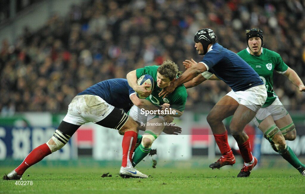 13 February 2010; Brian O'Driscoll, Ireland, is tackled by Imanol Harinordoquy, left, and theirry Dusautoir, France. RBS Six Nations Rugby Championship, France v Ireland, Stade de France, Saint Denis, Paris, France. Picture credit: Brendan Moran / SPORTSFILE