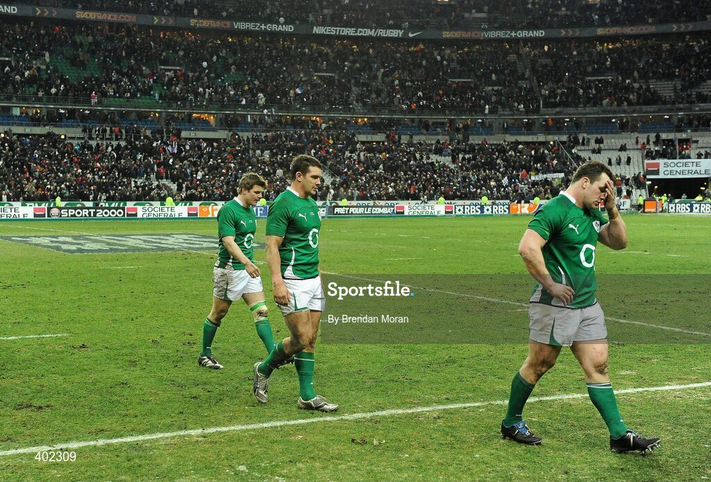 13 February 2010; Dejected Ireland players, from left, Brian O'Driscoll, David Wallace and Cian Healy leave the pitch after defeat to France. RBS Six Nations Rugby Championship, France v Ireland, Stade de France, Saint Denis, Paris, France. Picture credit: Brendan Moran / SPORTSFILE