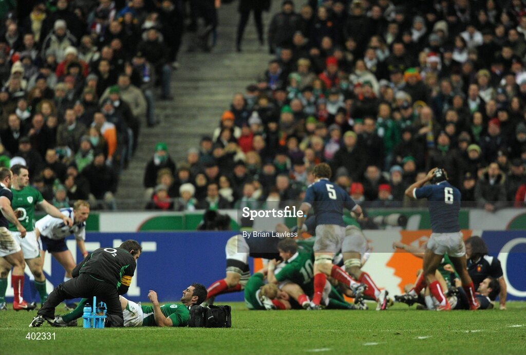 13 February 2010; Ireland's Rob Kearney is treated in the first half as play continues. RBS Six Nations Rugby Championship, France v Ireland, Stade de France, Saint Denis, Paris, France. Picture credit: Brian Lawless / SPORTSFILE