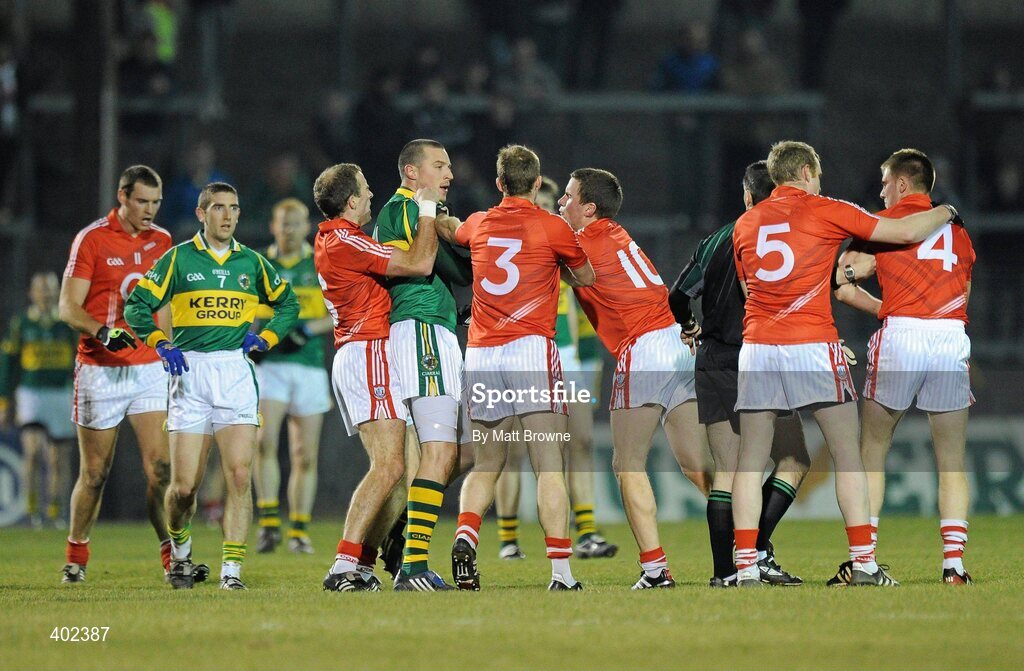 13 February 2010; Kieran Donaghy, Kerry, tussels with Cork players Paudie Kissane, 6, Michael Shields, 3, and Patrick Kelly,10. Allianz National Football League, Division 1, Round 2, Cork v Kerry, Pairc Ui Rinn, Cork. Picture credit: Matt Browne / SPORTSFILE