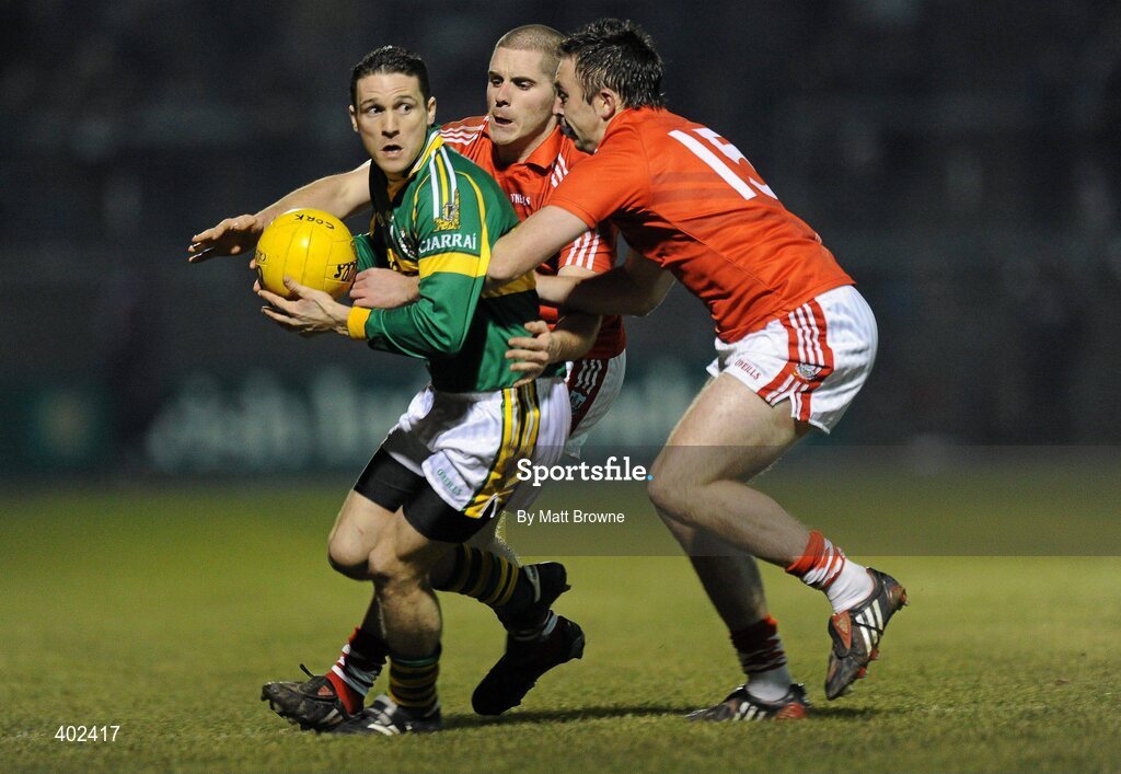 13 February 2010; Adrian O'Connell, Kerry, is tackled by Paul Kerrigan,15, and Daniel Goulding, Cork. Allianz National Football League, Division 1, Round 2, Cork v Kerry, Pairc Ui Rinn, Cork. Picture credit: Matt Browne / SPORTSFILE