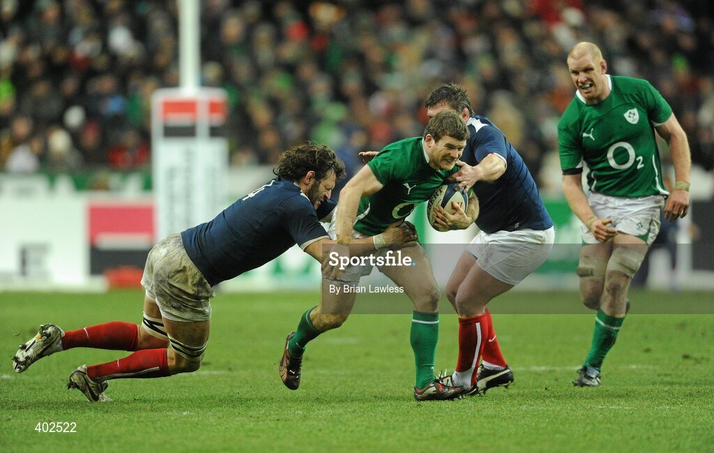 13 February 2010; Gordon D'Arcy, supported by Paul O'Connell, Ireland, is tackled by Lionel Nallet, left, and Thomas Domingo, France. RBS Six Nations Rugby Championship, France v Ireland, Stade de France, Saint Denis, Paris, France. Picture credit: Brian Lawless / SPORTSFILE