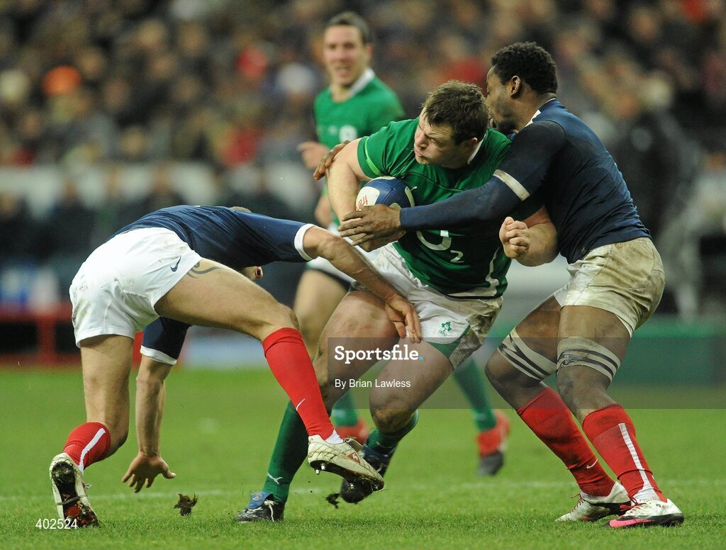 13 February 2010; Cian Healy, Ireland, is tackled by Francois Trinh-Duc, left, and Fulgence Ouedraogo, France. RBS Six Nations Rugby Championship, France v Ireland, Stade de France, Saint Denis, Paris, France. Picture credit: Brian Lawless / SPORTSFILE