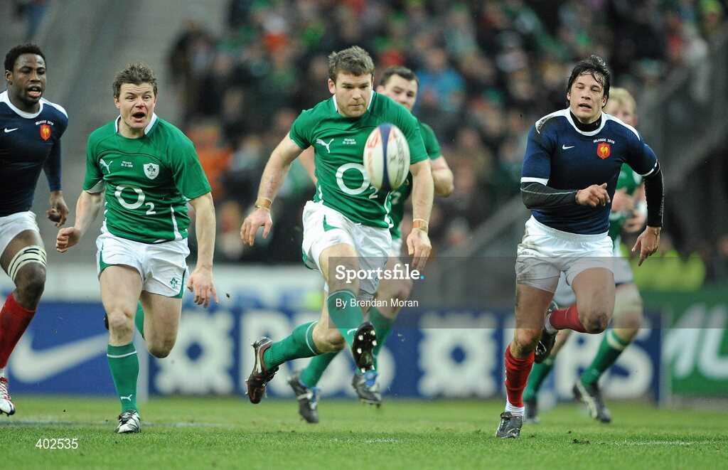 13 February 2010; Gordon D'Arcy, Ireland, supported by Brian O'Driscoll, kicks through the French defence. RBS Six Nations Rugby Championship, France v Ireland, Stade de France, Saint Denis, Paris, France. Picture credit: Brendan Moran / SPORTSFILE