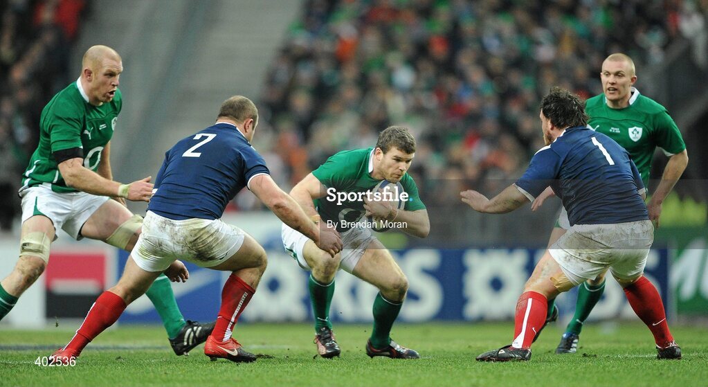 13 February 2010; Gordon D'Arcy, Ireland, supported by team-mates Paul O'Connell, left, and Keith Earls, takes on William Servat, 2, and Thomas Domingo, France. RBS Six Nations Rugby Championship, France v Ireland, Stade de France, Saint Denis, Paris, France. Picture credit: Brendan Moran / SPORTSFILE