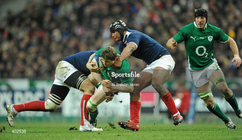 13 February 2010; Brian O'Driscoll, Ireland, is tackled by Imanol Harinordoquy, left, and theirry Dusautoir, France. RBS Six Nations Rugby Championship, France v Ireland, Stade de France, Saint Denis, Paris, France. Picture credit: Brendan Moran / SPORTSFILE