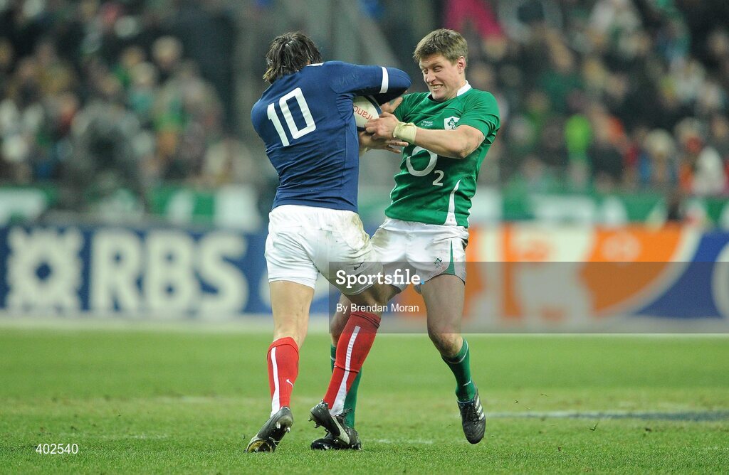13 February 2010; Ronan O'Gara, Ireland, is pushed off by Francois Trinh-Duc, France. RBS Six Nations Rugby Championship, France v Ireland, Stade de France, Saint Denis, Paris, France. Picture credit: Brendan Moran / SPORTSFILE