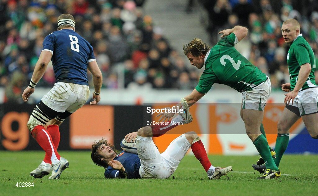 13 February 2010; Alexis Palisson, France, falls to the ground after an alleged kick by Jerry Flannery, 2, Ireland. RBS Six Nations Rugby Championship, France v Ireland, Stade de France, Saint Denis, Paris, France. Picture credit: Brendan Moran / SPORTSFILE *** Local Caption ***