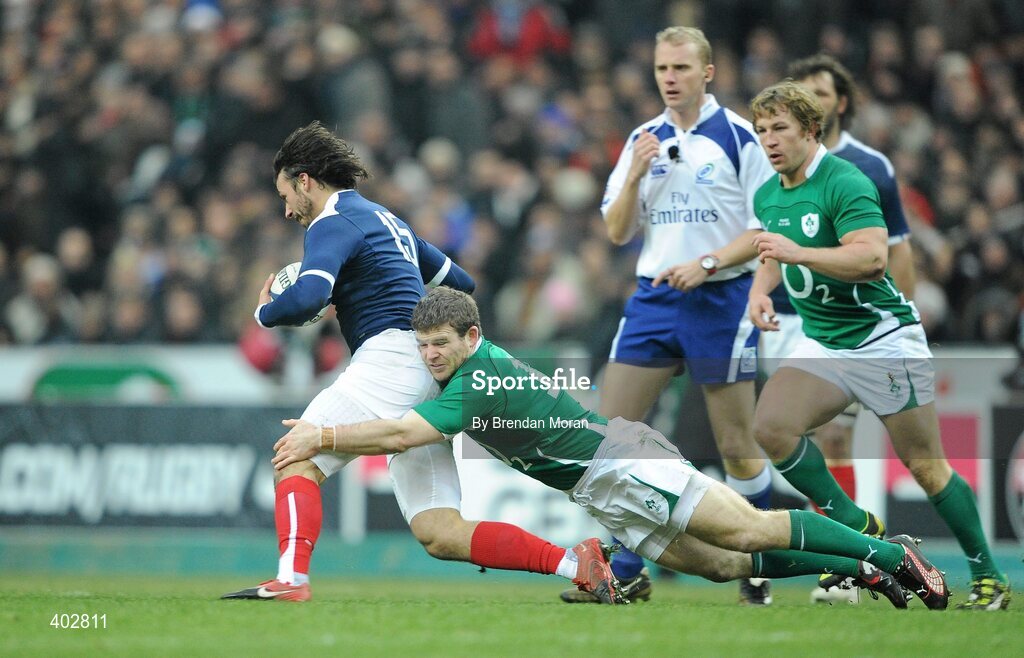 13 February 2010; Clement Piotrenaud, France, escapes the tackle of Gordon D'Arcy. RBS Six Nations Rugby Championship, France v Ireland, Stade de France, Saint Denis, Paris, France. Picture credit: Brendan Moran / SPORTSFILE *** Local Caption ***
