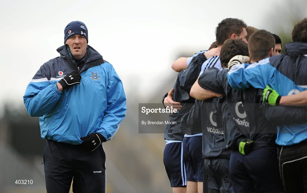 7 February 2010; Dublin manager Pat Gilroy looks on as his squad gather together in a huddle before the game. Allianz GAA Football National League, Division 1, Round 1, Kerry v Dublin. Fitzgerald Stadium, Killarney. Picture credit: Brendan Moran / SPORTSFILE