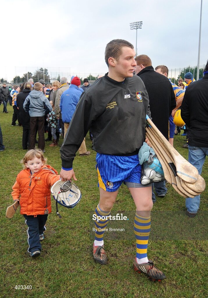 14 February 2010; Portumna goalkeeper Ivan Canning leaves the pitch with his son Andrew, aged 3. AIB GAA Hurling All-Ireland Senior Club Championship Semi-Final, Portumna v Dunloy Cuchullians, Parnell Park, Dublin. Picture credit: Dáire Brennan / SPORTSFILE