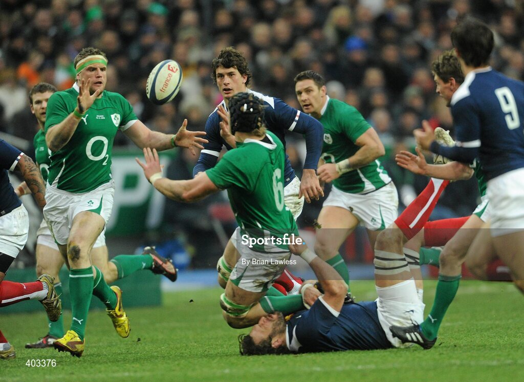 13 February 2010; Ireland's Jamie Heaslip receives the ball from team-mate Stephen Ferris, who is tackled by Lionel Nallet, France. RBS Six Nations Rugby Championship, France v Ireland, Stade de France, Saint Denis, Paris, France. Picture credit: Brian Lawless / SPORTSFILE *** Local Caption ***