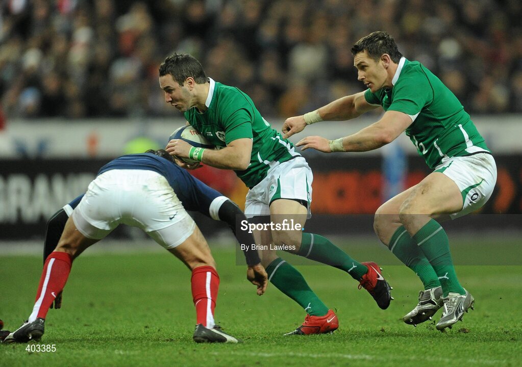 13 February 2010; Paddy Wallace, supported by David Wallace, right, Ireland, is tackled by Francois Trinh-Duc, France. RBS Six Nations Rugby Championship, France v Ireland, Stade de France, Saint Denis, Paris, France. Picture credit: Brian Lawless / SPORTSFILE *** Local Caption ***