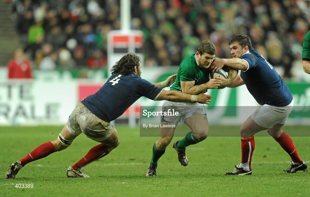 13 February 2010; Gordon D'Arcy, Ireland, is tackled by Lionel Nallet, left, and Thomas Domingo, France. RBS Six Nations Rugby Championship, France v Ireland, Stade de France, Saint Denis, Paris, France. Picture credit: Brian Lawless / SPORTSFILE *** Local Caption ***