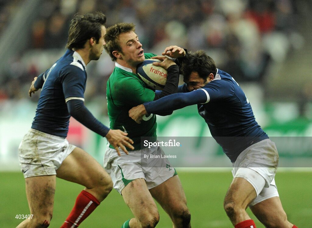 13 February 2010; Tommy Bowe, Ireland, is tackled by David Marty, left, and Morgan Parra, France. RBS Six Nations Rugby Championship, France v Ireland, Stade de France, Saint Denis, Paris, France. Picture credit: Brian Lawless / SPORTSFILE *** Local Caption ***