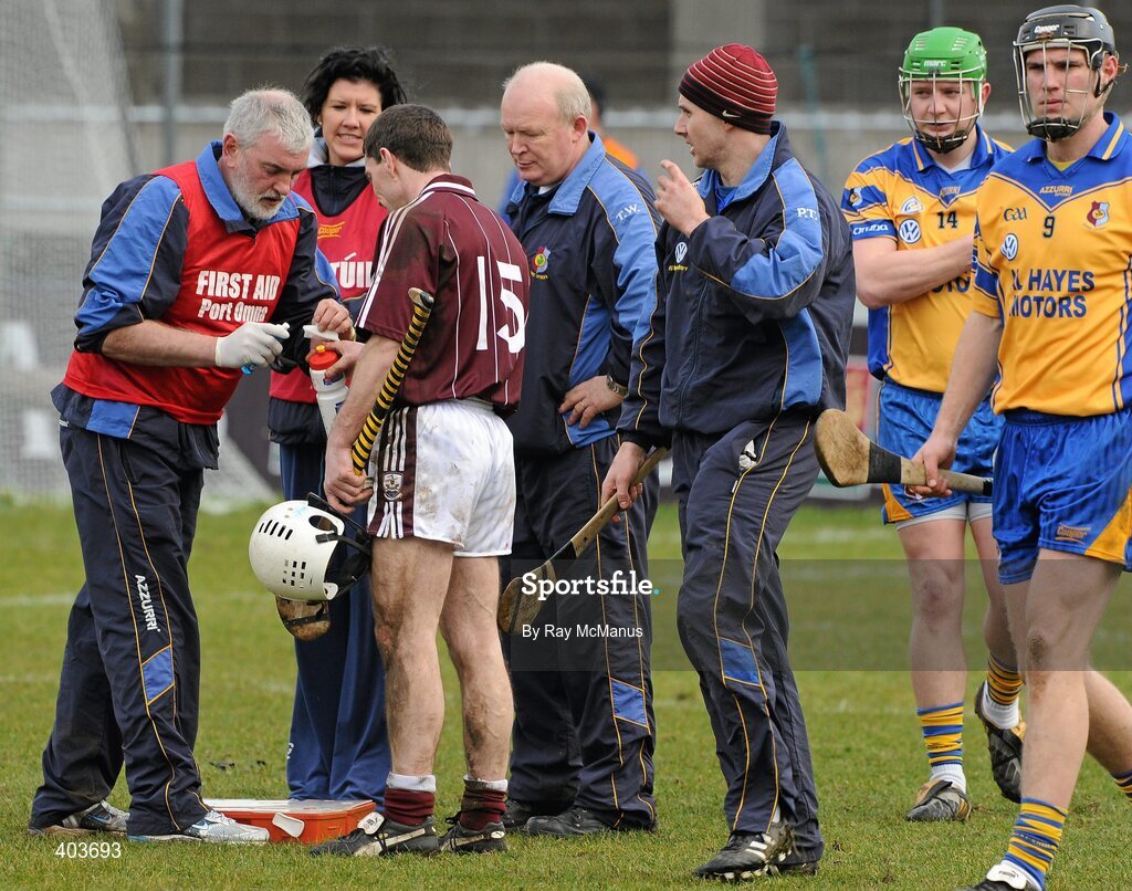 14 February 2010; Galway corner forward Niall Hayes has a a finger injury addressed by his Portumna club man Joe Heagney before the game. Hayes had just finished assisting Galway win the Walsh Cup. AIB GAA Hurling All-Ireland Senior Club Championship Semi-Final, Portumna v Dunloy Cuchullians, Parnell Park, Dublin. Picture credit: Ray McManus / SPORTSFILE