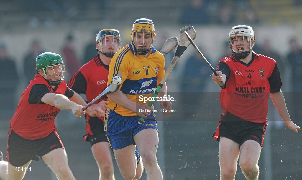 21 February 2010; John Conlon, Clare, in action against, from left, Fintan Conway, Connor Woods, and Sean Ennis, Down. Allianz GAA Hurling National League, Division 2 Round 1, Clare v Down. Cusack Park, Ennis, Co. Clare. Picture credit: Diarmuid Greene / SPORTSFILE