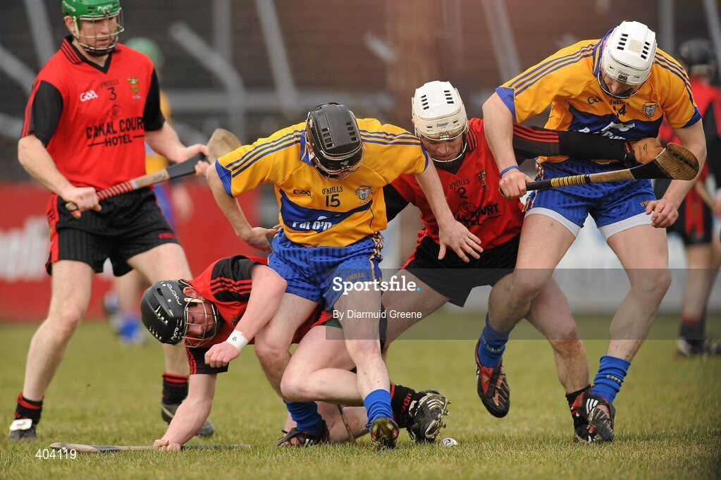 21 February 2010; Clare's Martin 'Ogie' Murphy, left, and Mark Flaherty battle for possession with Down's Matthew Teague, left and Liam Clarke. Allianz GAA Hurling National League, Division 2 Round 1, Clare v Down. Cusack Park, Ennis, Co. Clare. Picture credit: Diarmuid Greene / SPORTSFILE