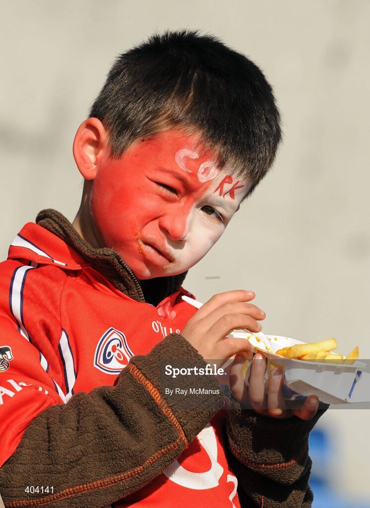 21 February 2010; A young Cork supporter enjoys a carton of chips before the game. Allianz GAA Hurling National League Division 1 Round 1, Cork v Offaly. Pairc Ui Chaoimh, Cork. Picture credit: Ray McManus / SPORTSFILE