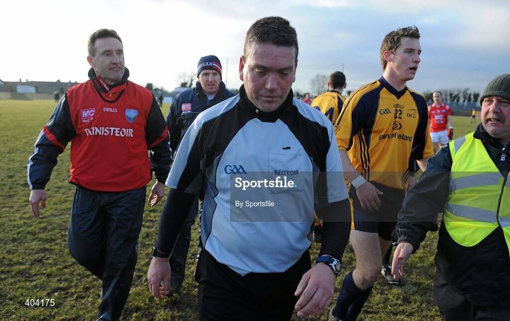 21 February 2010; Louth manager Peter Fitzpatrick, left, remonstrates with referee Joe Curley after he blew the final whistle before the ball went out of play and UCD won the game by a point. O'Byrne Cup Final, Louth v Dublin City University. Dowdallshill, Dundalk, Co. Louth. Photo by Sportsfile