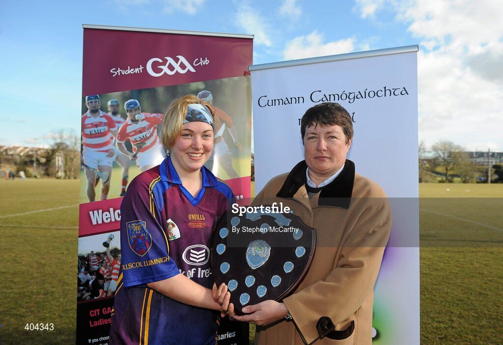 21 February 2010; UL captain Aine Lyng is preseneted with the Ashbourne Shield by Lynn Kelly, President of 3rd Level Camogie Association, following victory over CIT. Ashbourne Shield Final, Cork Institute of Technology v University of Limerick. Cork Institute of Technology, Cork. Picture credit: Stephen McCarthy / SPORTSFILE