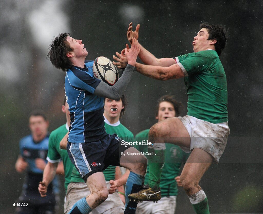 23 February 2010; Fergus Halpin, Newpark Comprehensive, takes a dropping ball ahead of Mark McGroarty, Gonzaga College SJ. Vinnie Murray Semi-Final, Newpark Comprehensive v Gonzaga College SJ, Old Belvedere RFC, Anglesea Road, Dublin. Picture credit: Stephen McCarthy / SPORTSFILE *** Local Caption ***