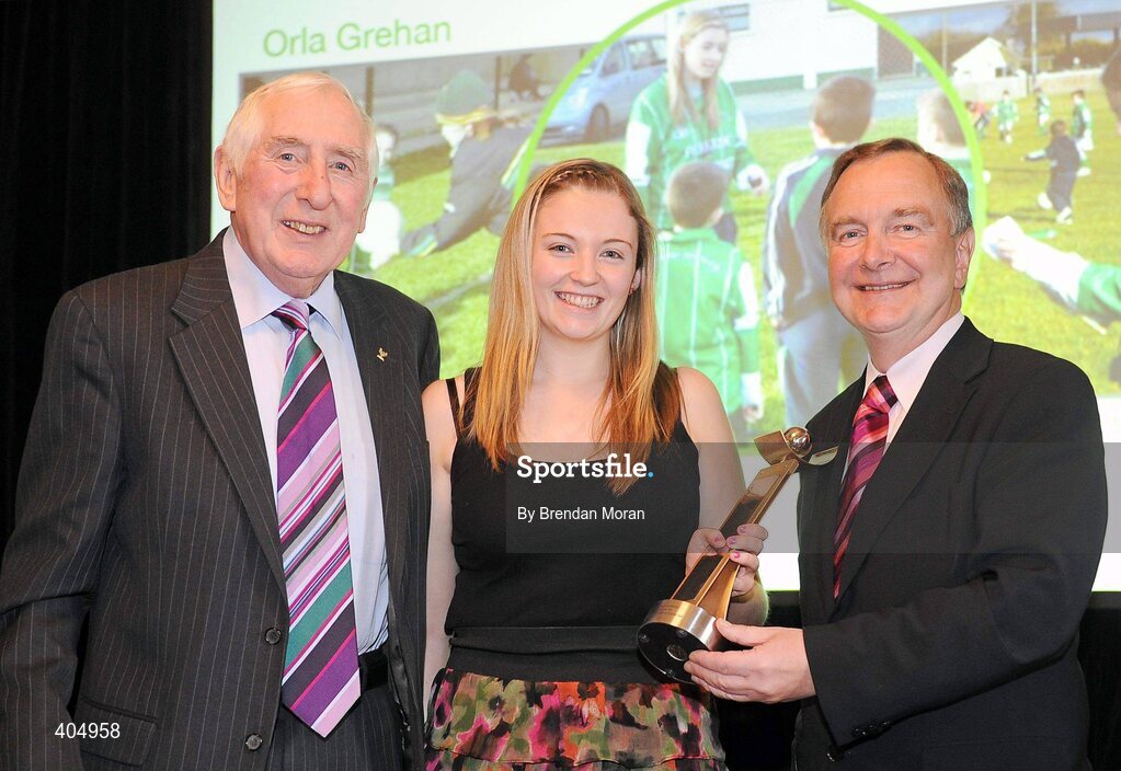 24 February 2010; Junior Volunteer of the Year Orla Grehan, from Ferbane, Co. Offaly, is presented with her award by Irish Olympian Dr. Ronnie Delany, left, and Martin Cullen, TD, Minister for Arts, Sport and Tourism, at the Volunteers in Irish Sports Awards 2009. Farmleigh, Castleknock, Dublin. Picture credit: Brendan Moran / SPORTSFILE