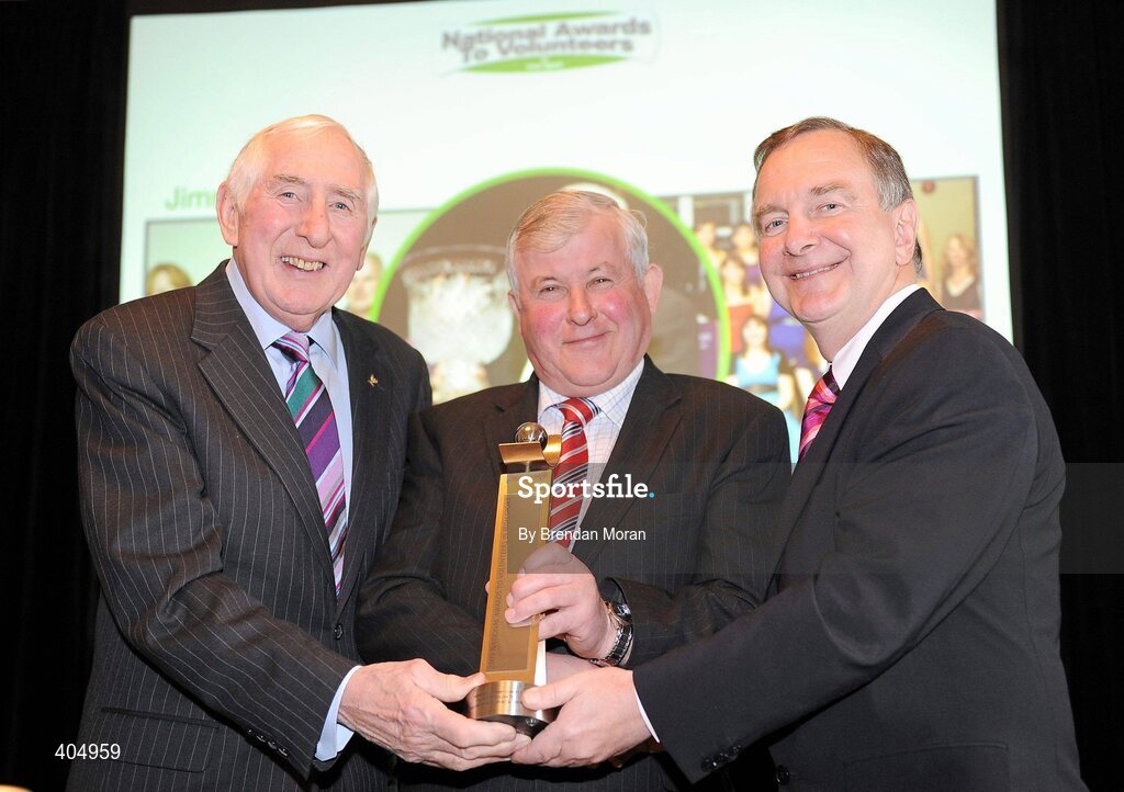 24 February 2010; Adult Manager of the Year Jimmy Corbett, from Ballyglass, Claremorris, Co. Mayo, is presented with his award by Irish Olympian Dr. Ronnie Delany, left, and Martin Cullen, TD, Minister for Arts, Sport and Tourism, at the Volunteers in Irish Sports Awards 2009. Farmleigh, Castleknock, Dublin. Picture credit: Brendan Moran / SPORTSFILE