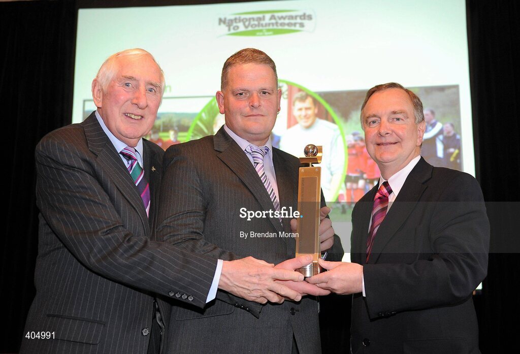 24 February 2010; Youth Manager of the Year Hughie Nolan, from Newtownmountkennedy, Co. Wicklow, is presented with his award by Irish Olympian Dr. Ronnie Delany, left, and Martin Cullen, TD, Minister for Arts, Sport and Tourism, at the Volunteers in Irish Sports Awards 2009. Farmleigh, Castleknock, Dublin. Picture credit: Brendan Moran / SPORTSFILE