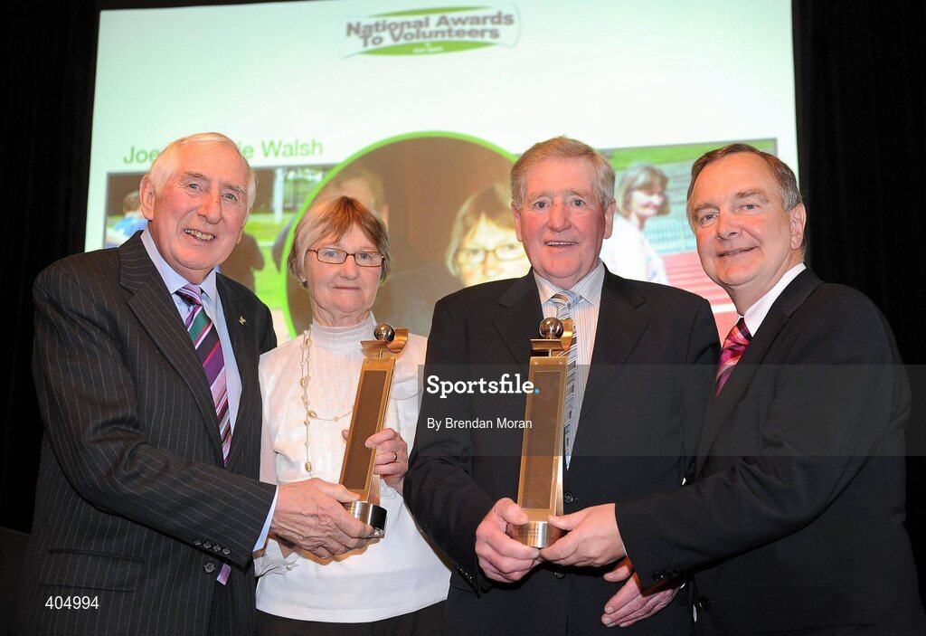 24 February 2010; Disability Sports Volunteers of the Year Bernie and Joe Walsh, from Swords, Dublin, are presented with their award by Irish Olympian Dr. Ronnie Delany, left, and Martin Cullen, TD, Minister for Arts, Sport and Tourism, during the Volunteers in Irish Sports Awards 2009 at Farmleigh in Castleknock, Dublin. Photo by Brendan Moran/Sportsfile