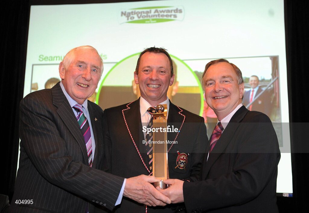 24 February 2010; Youth Coach of the Year Seamus Reynolds, from Coleraine, Co. Derry, is presented with his award by Irish Olympian Dr. Ronnie Delany, left, and Martin Cullen, TD, Minister for Arts, Sport and Tourism, at the Volunteers in Irish Sports Awards 2009. Farmleigh, Castleknock, Dublin. Picture credit: Brendan Moran / SPORTSFILE