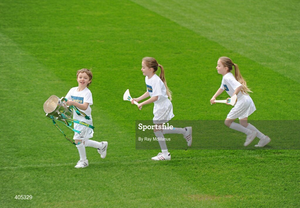 26 February 2010; GAA Stars of the future, Kelli and Alanna Clarke, from Castleknock, Dublin, chase Max Lally, Ashbourne, with the Liam MacCarthy Cup at the announcement of a new partnership with Centra and its 558 retail partners. Centra have been confirmed as an official sponsor of the GAA Hurling All-Ireland Championship. Croke Park, Dublin. Picture credit: Ray McManus / SPORTSFILE