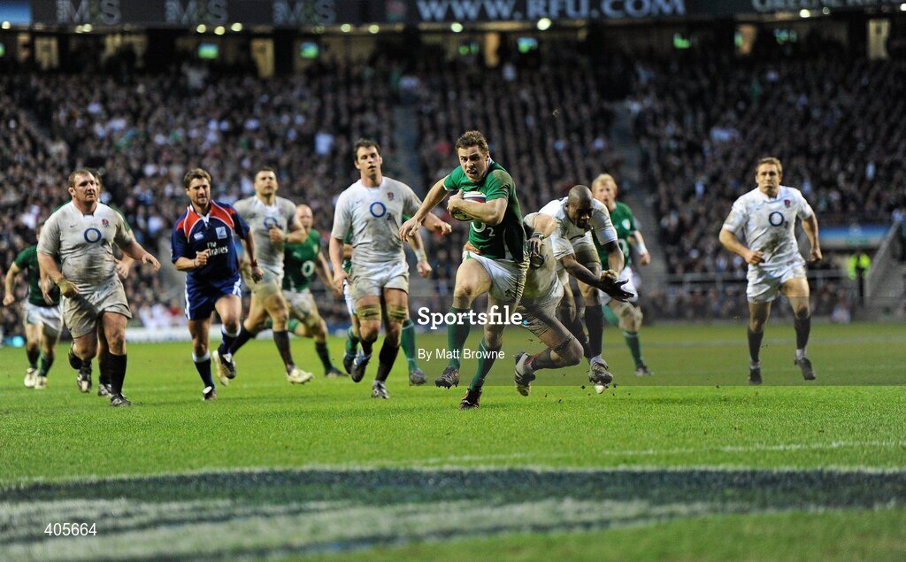 27 February 2010; Tommy Bowe, Ireland, goes past the tackles of James Haskell and Ugo Moyne, England on his way to scoring his side's third try. RBS Six Nations Rugby Championship, England v Ireland, Twickenham Stadium, Twickenham, London, England. Picture credit: Matt Browne / SPORTSFILE